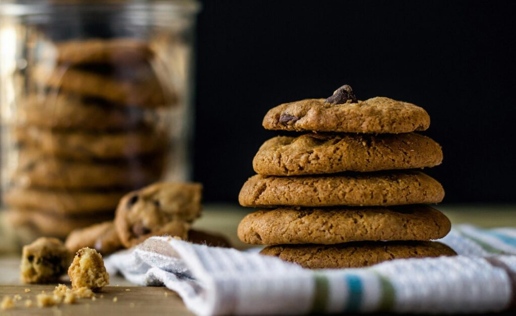 Assorted cookies and colorful macarons from Inbaa’s Bakehouse, freshly baked.