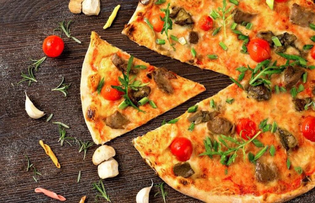 "Wood-fired pizzas and live cooking counter at Inbaa’s Bakehouse, fresh and aromatic